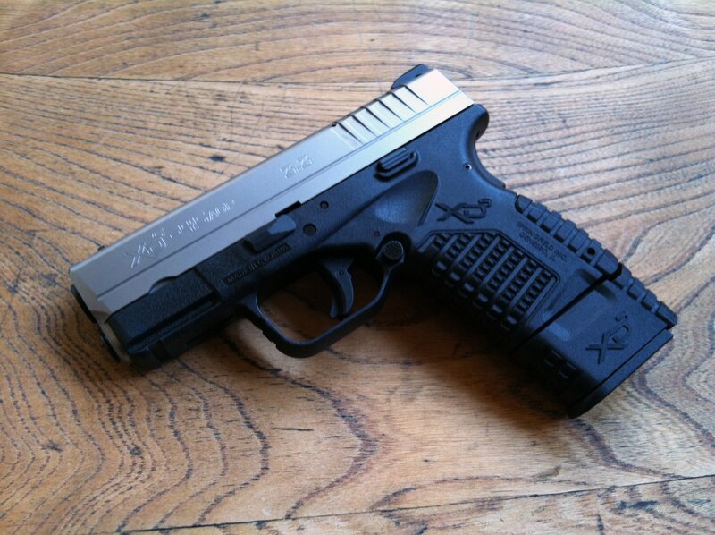 Black and Silver Handgun — Brown