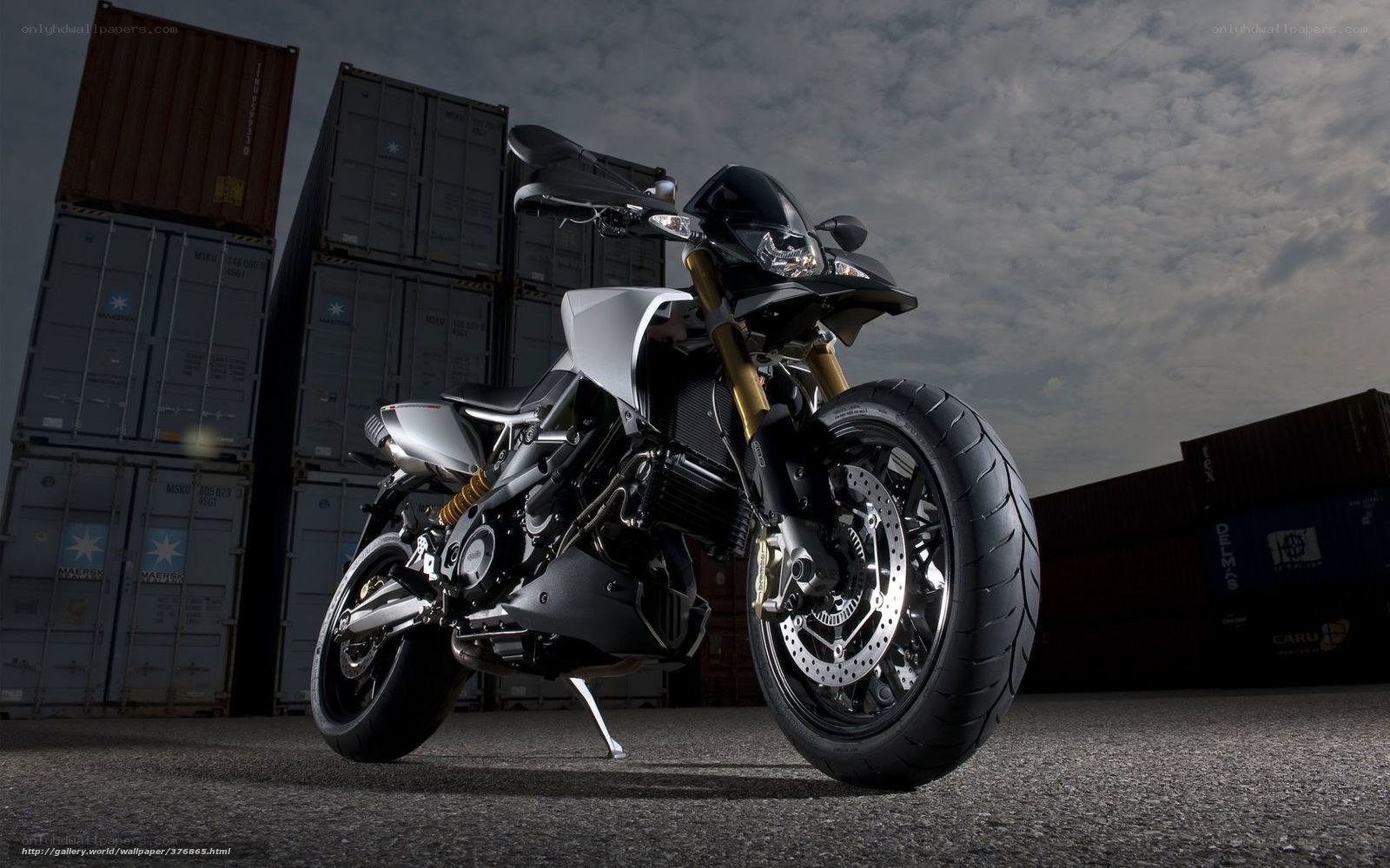 Black and silver motorcycle in shipping yard