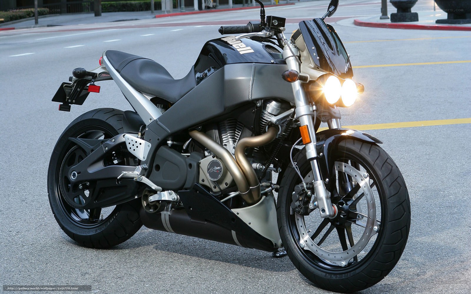 Black and silver motorcycle on street