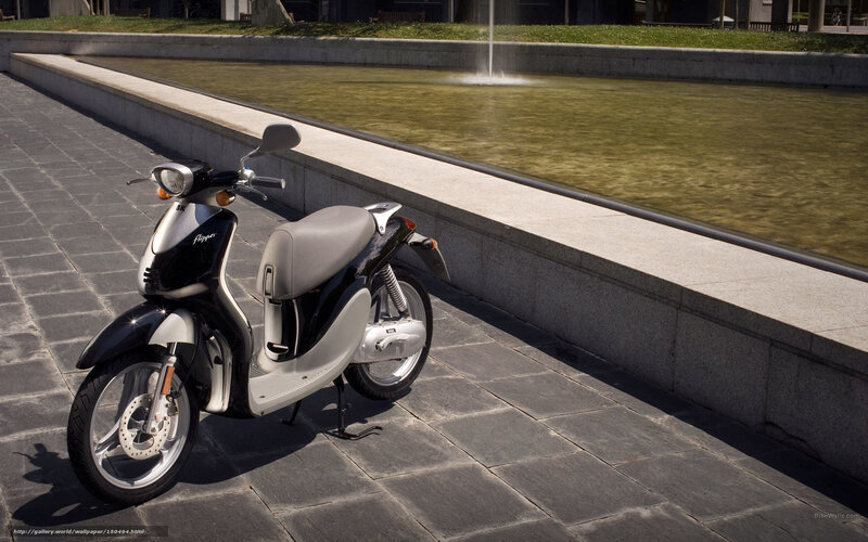 Black and silver scooter by fountain