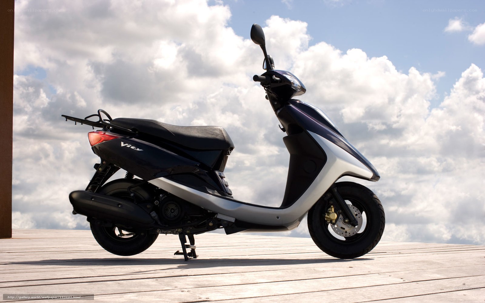 Black and silver scooter on deck