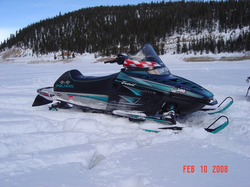 Black and Teal Snowmobile