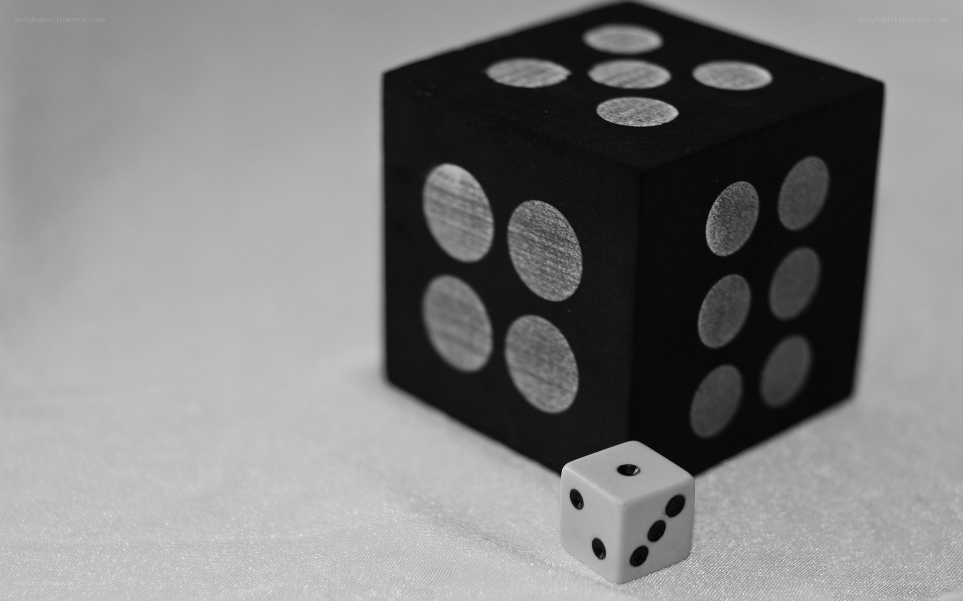 Black and white dice on fabric