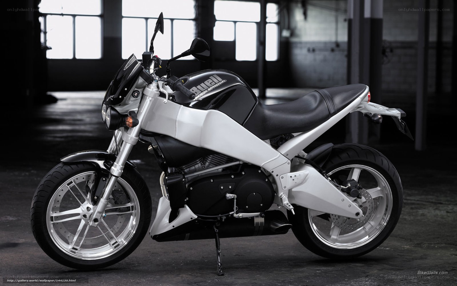 Black and white motorcycle in warehouse