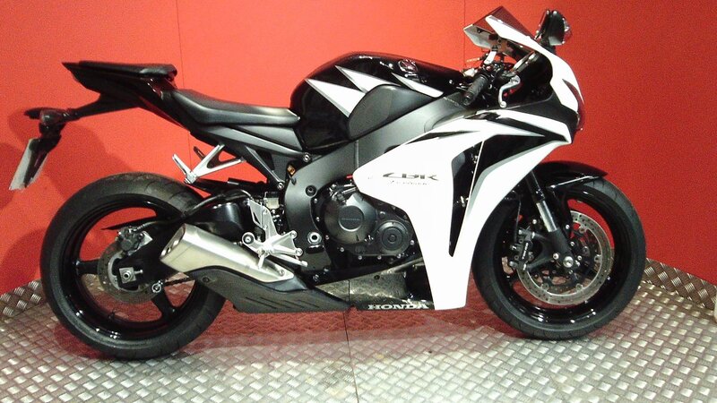 Black and White Motorcycle — Neutral, Photograph, Red Wall