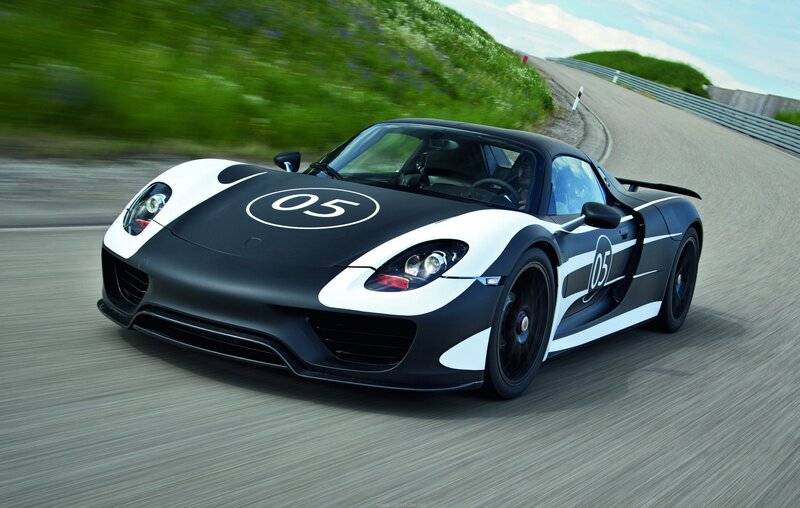Black and White Sports Car — Dynamic, Afternoon, Photograph, Race Track, Green Hillside