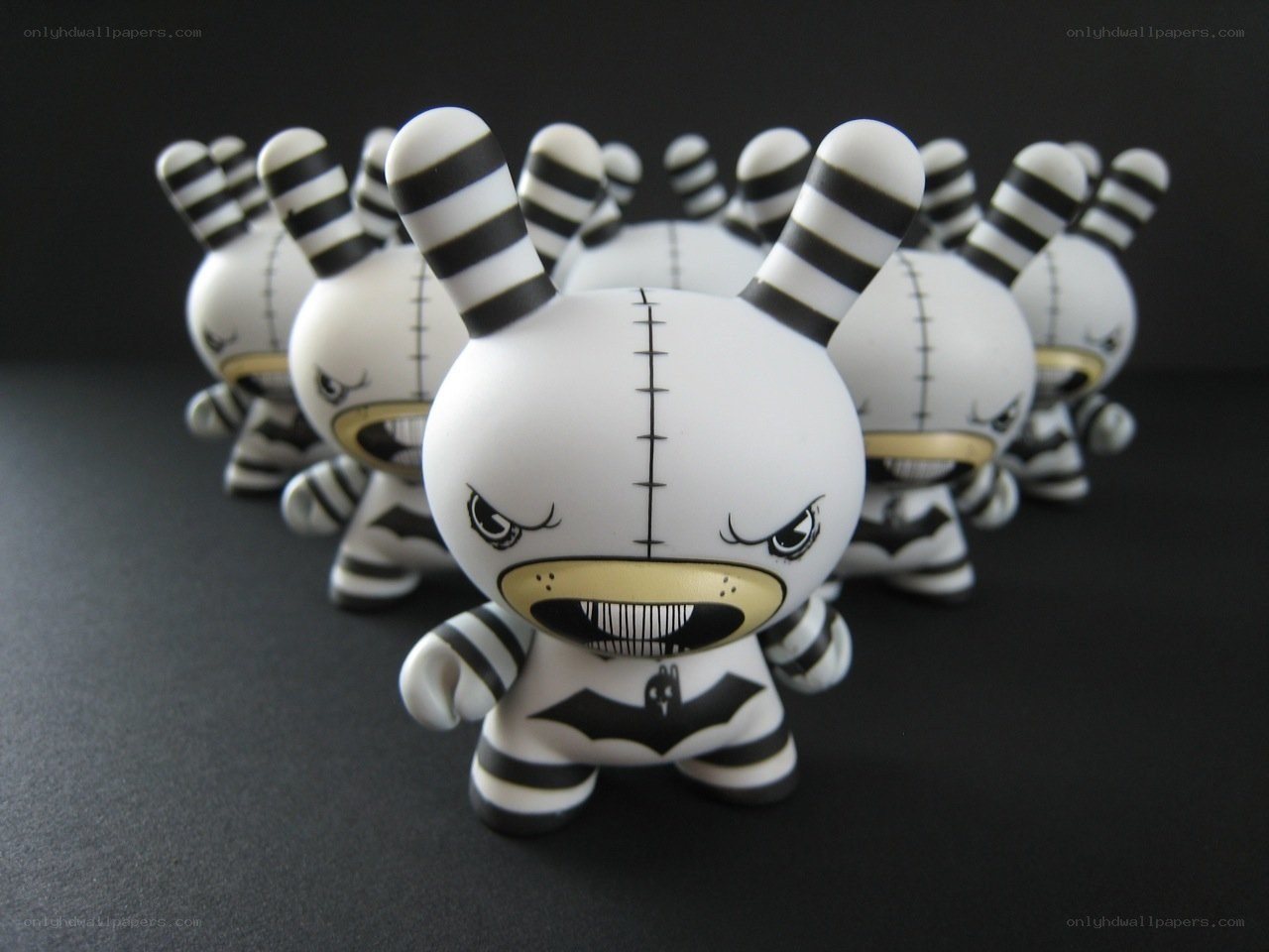 Black and white striped toy figures