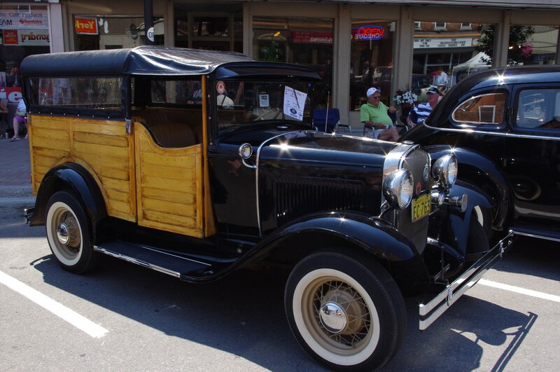 Black and Wood-paneled Car