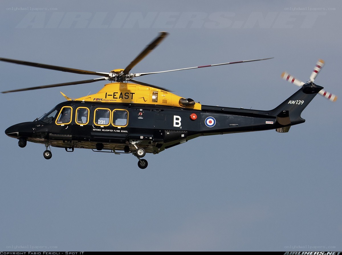 Black and yellow helicopter in flight