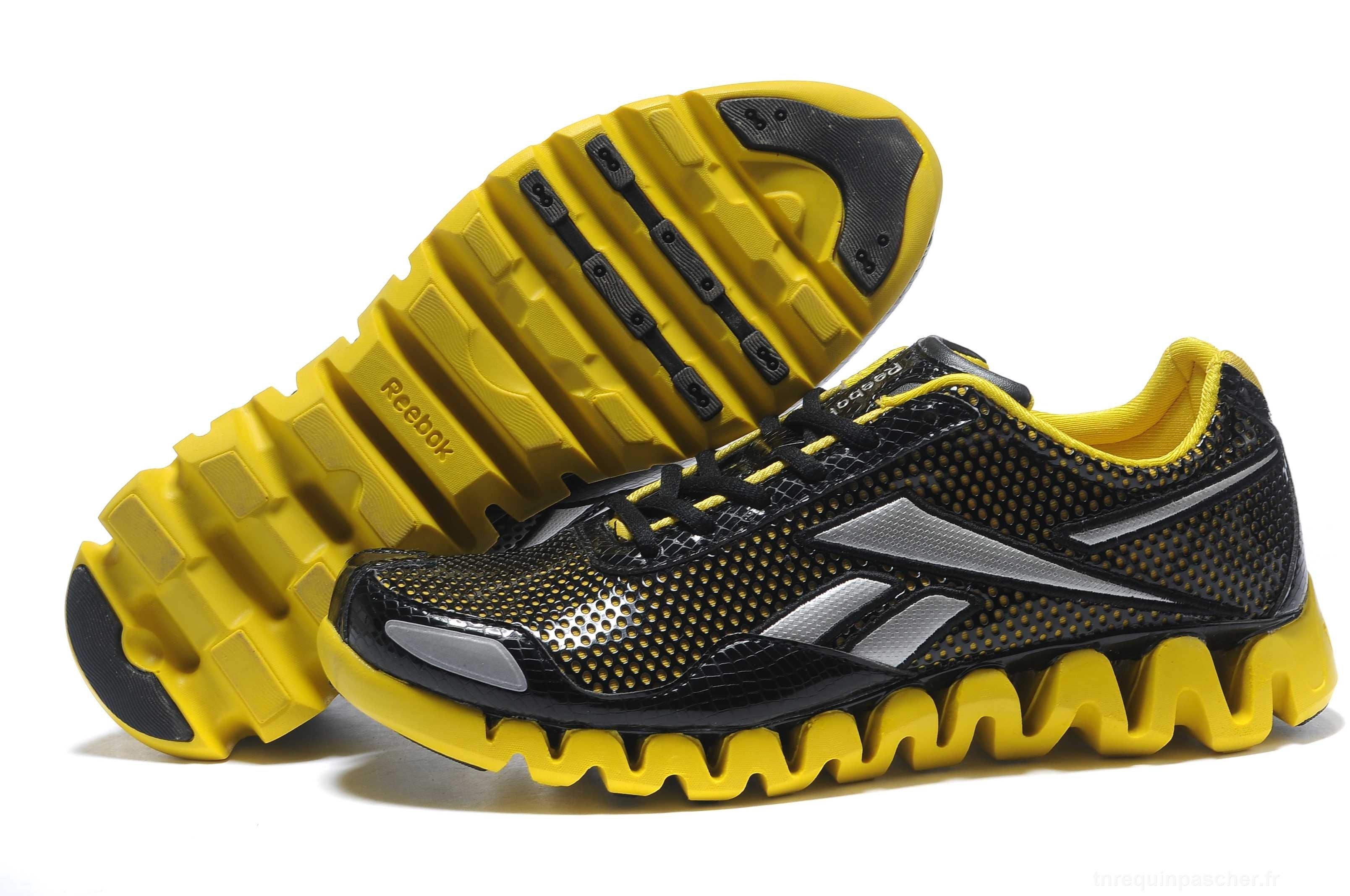 black and yellow reebok running shoes