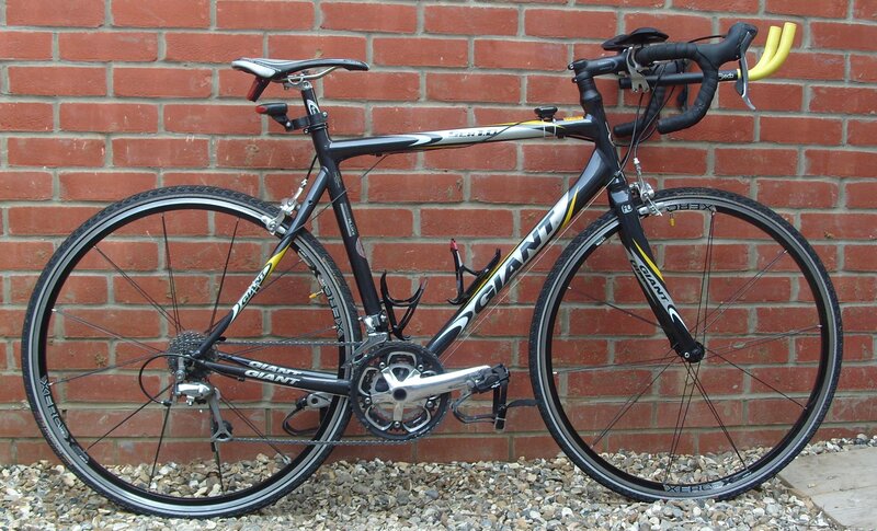 black and yellow road bicycle