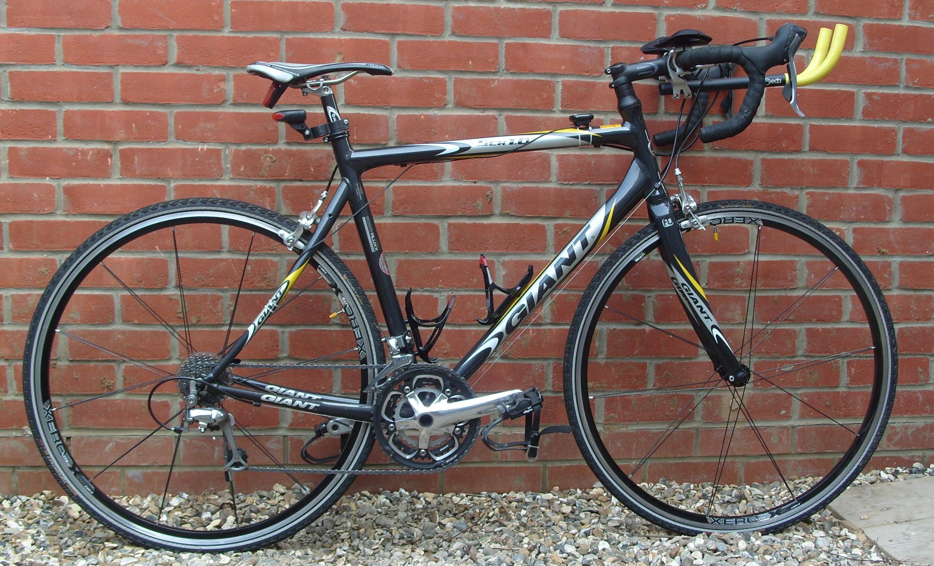black and yellow road bicycle