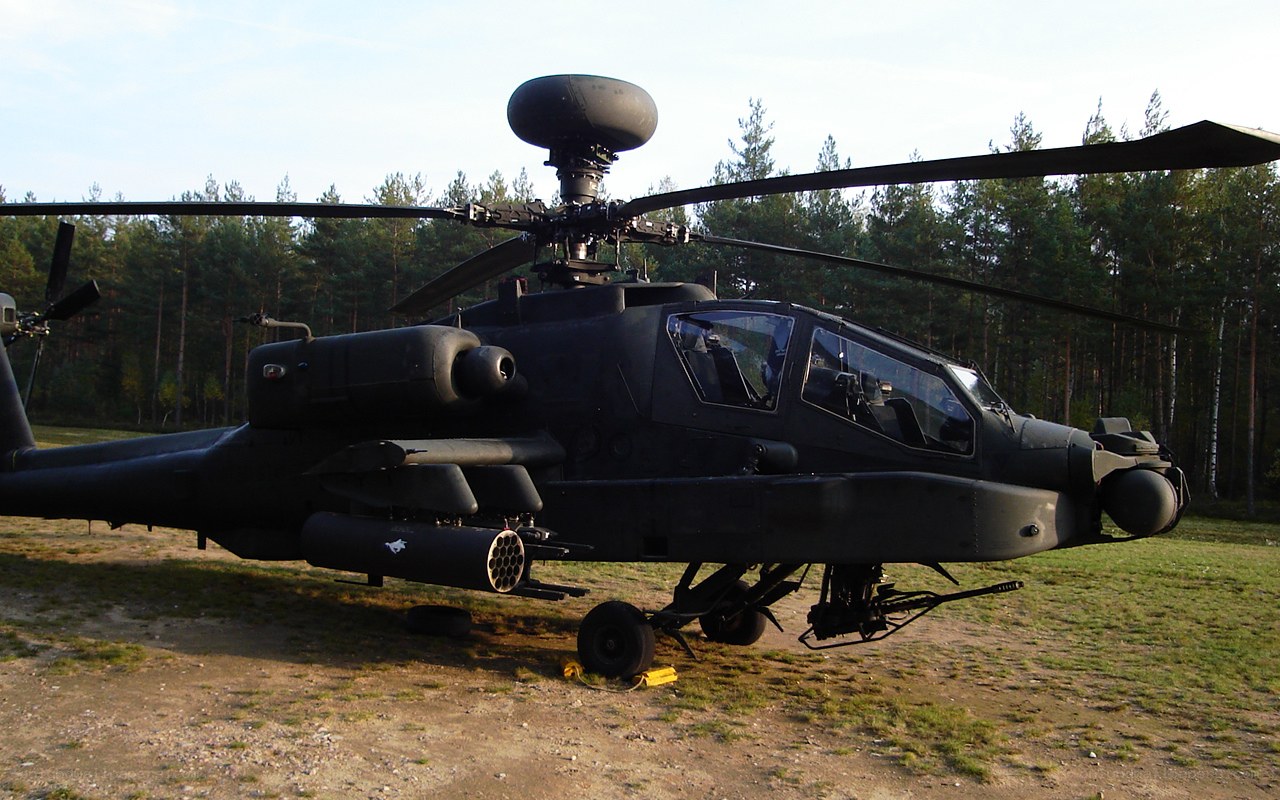 Black Apache helicopter on ground