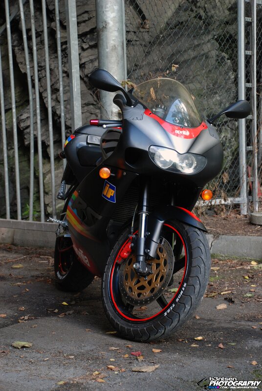 Black Aprilia motorcycle with red accents