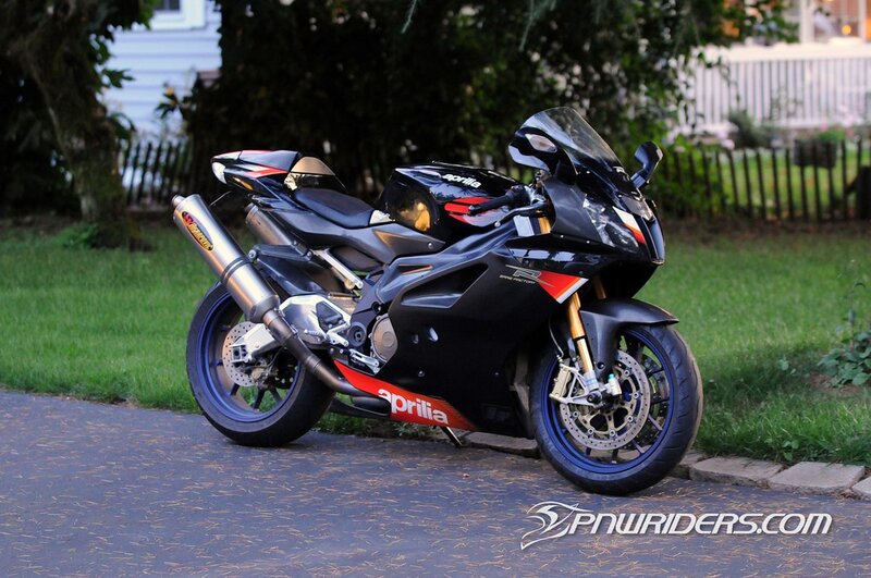 Black Aprilia sportbike on driveway