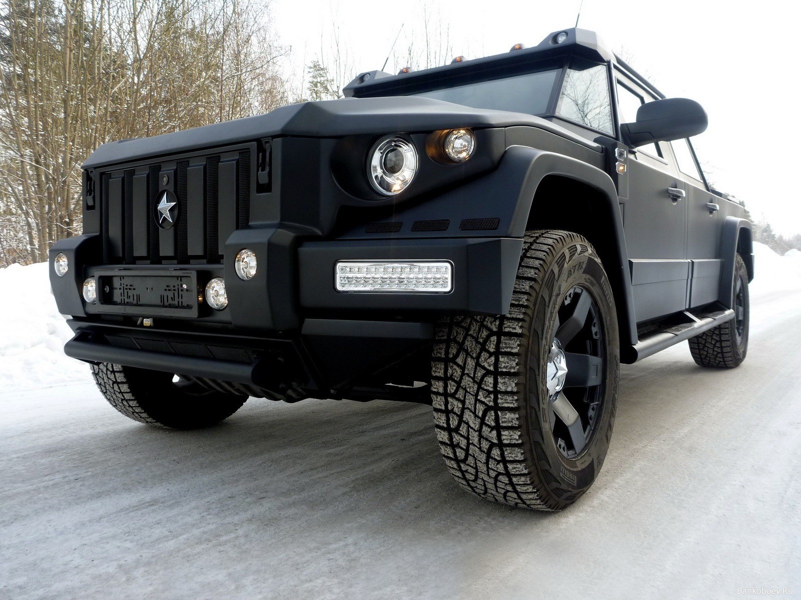 black armored SUV on snowy road