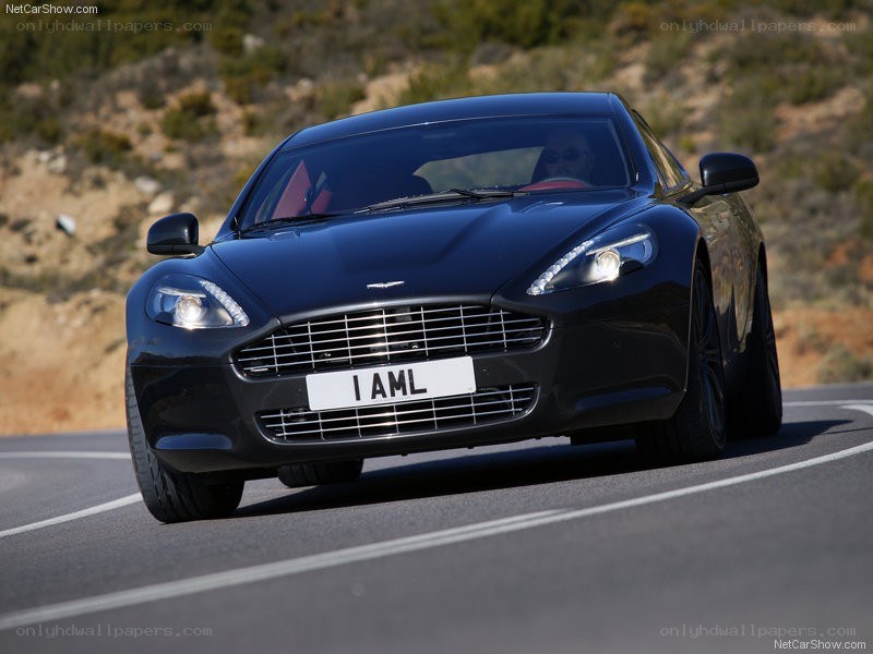 black aston martin driving