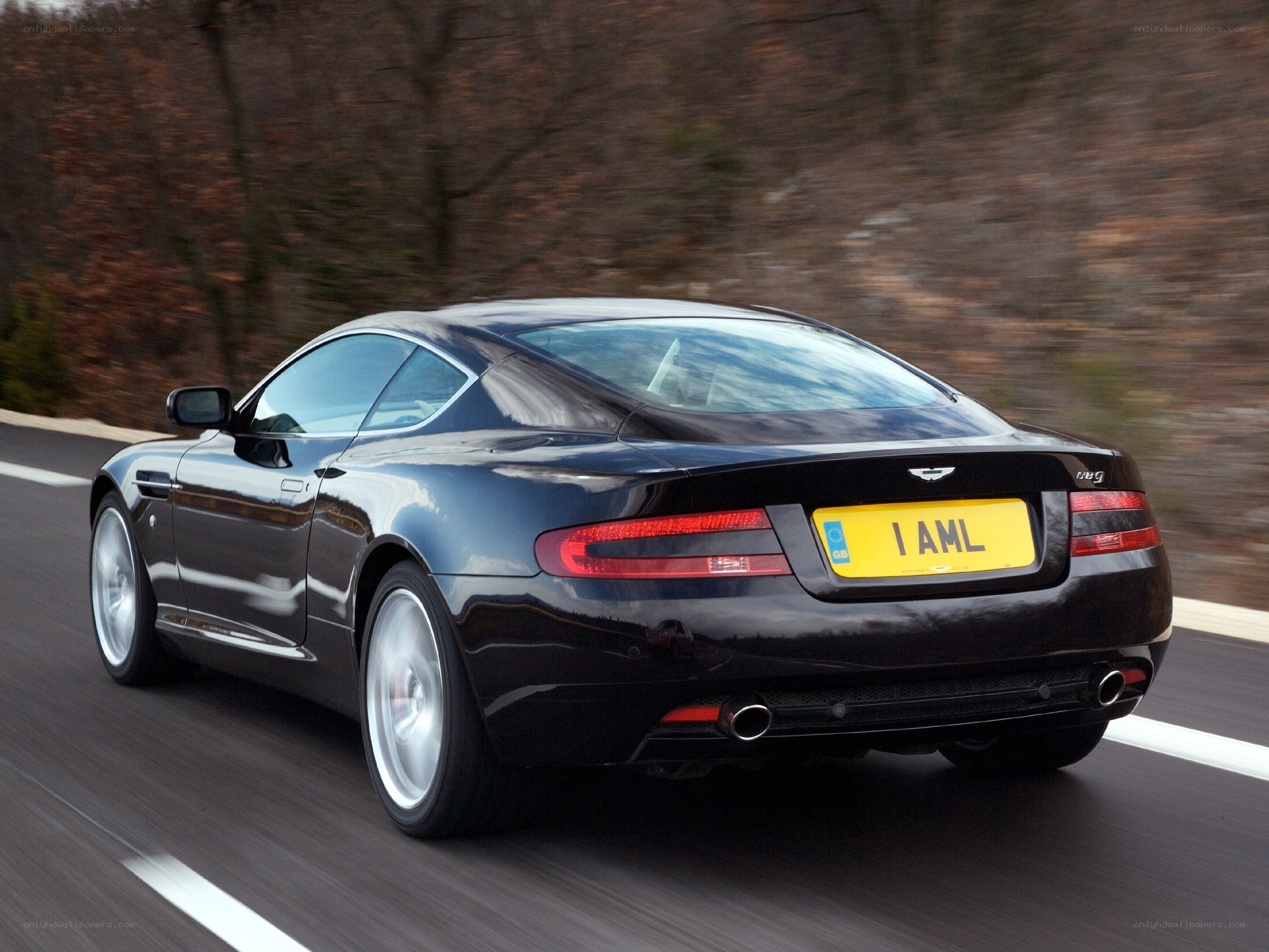 black aston martin driving