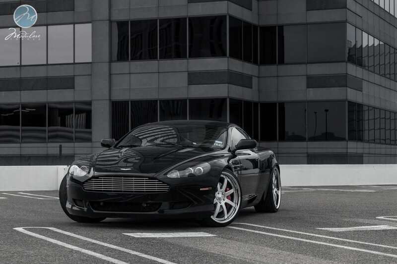 Black Aston Martin in parking lot