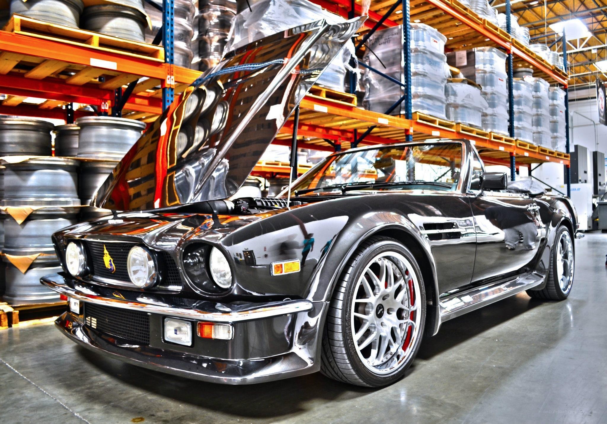 Black Aston Martin in warehouse