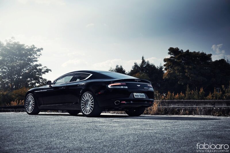 Black Aston Martin on asphalt
