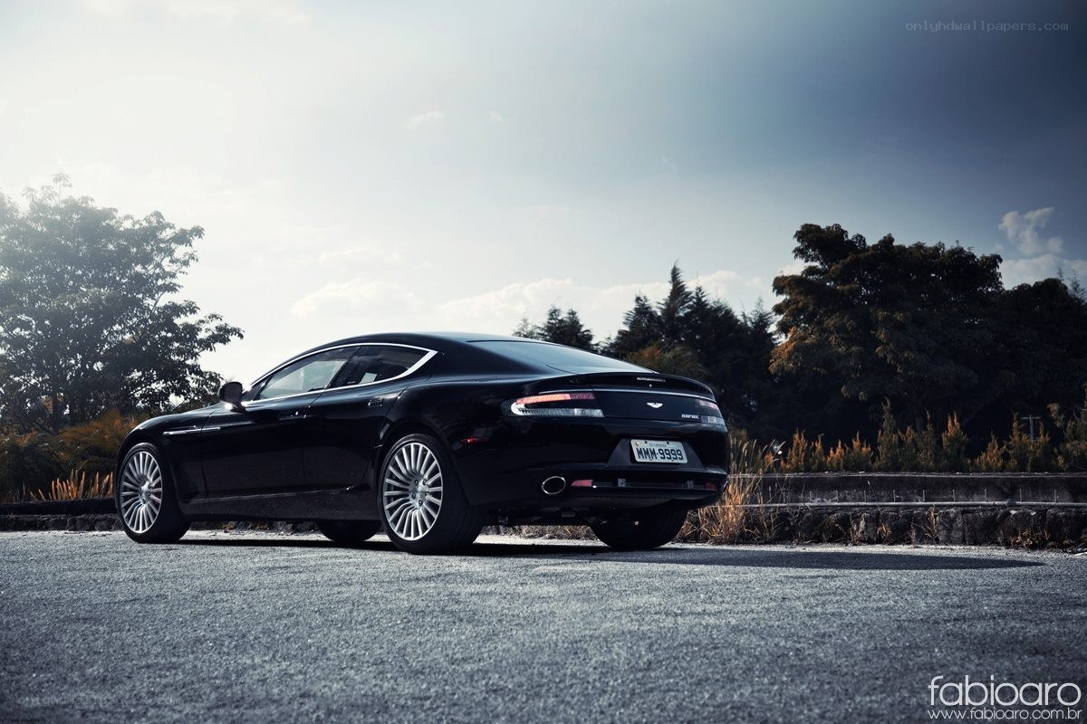 Black Aston Martin on asphalt