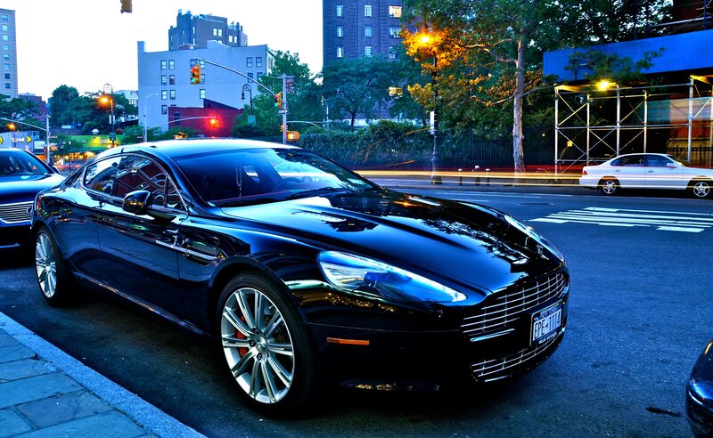 Black Aston Martin on city street