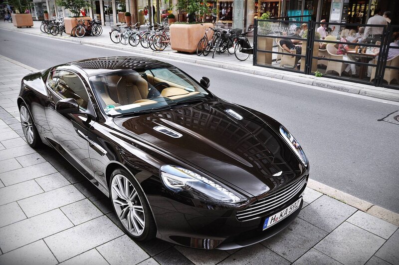 Black Aston Martin on city street
