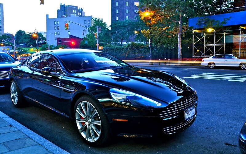 Black Aston Martin on city street