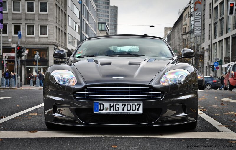 Black Aston Martin on city street