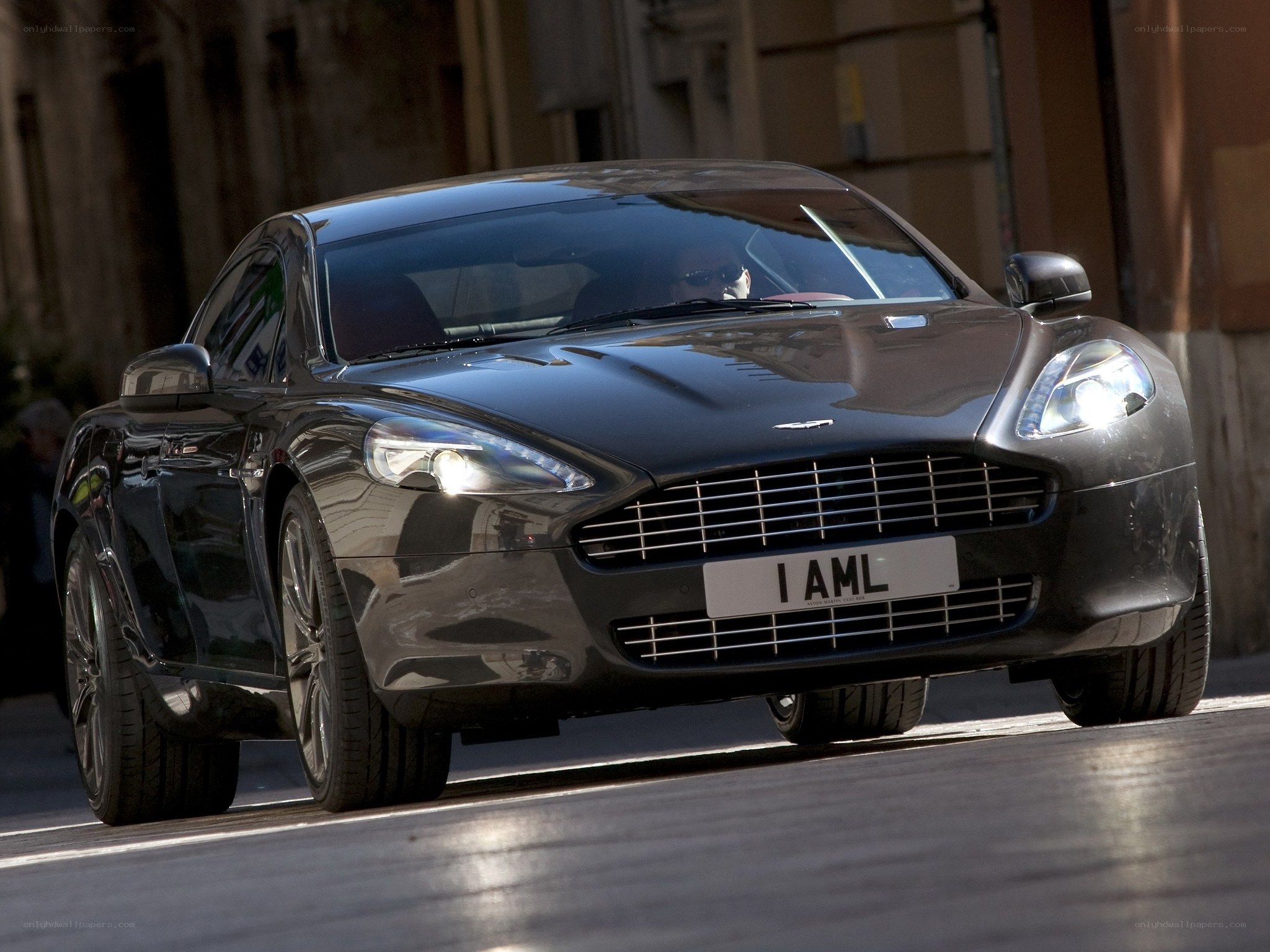 Black Aston Martin on city street