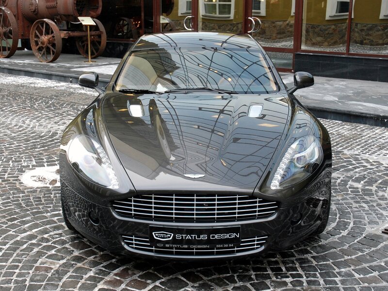 Black Aston Martin on cobblestones