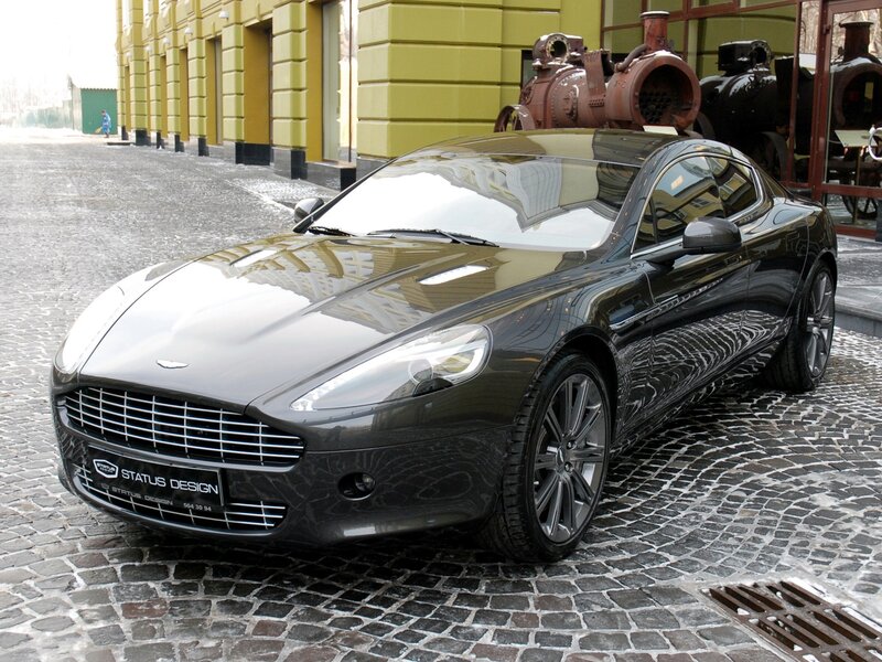 Black Aston Martin on cobblestones