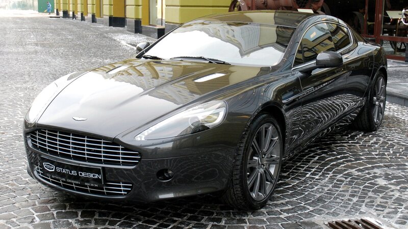 black aston martin on cobblestones