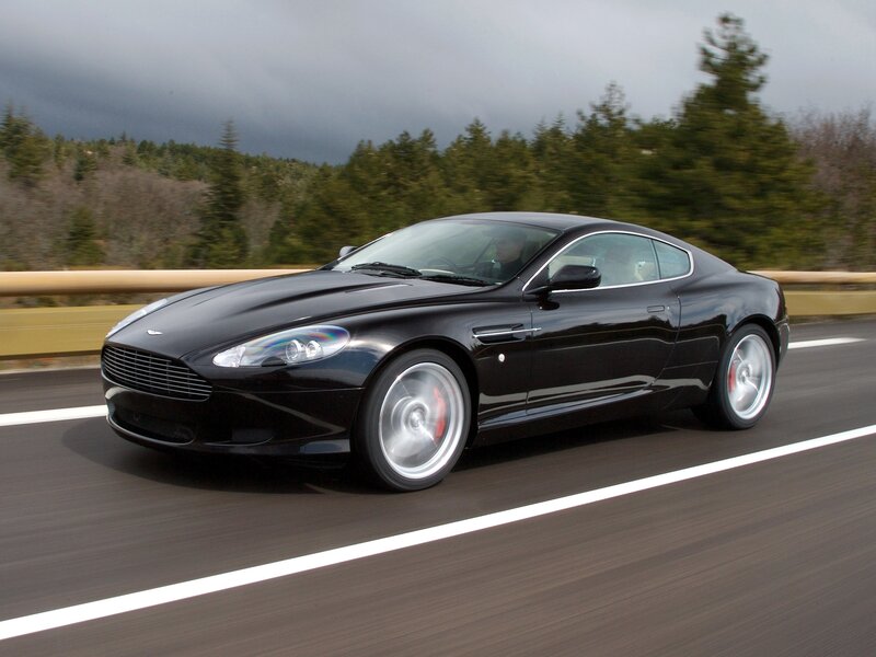 Black Aston Martin on highway