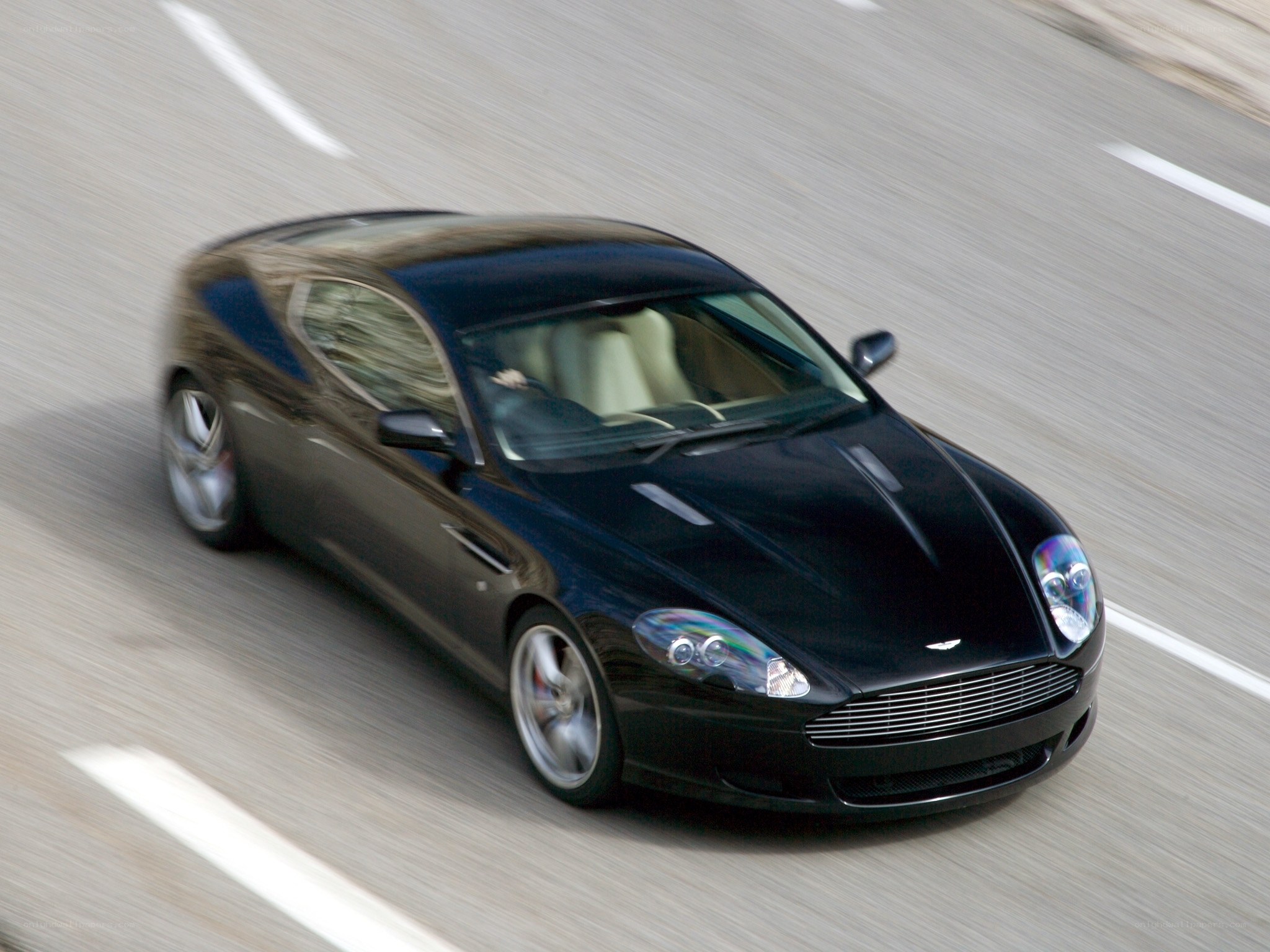 Black Aston Martin on road