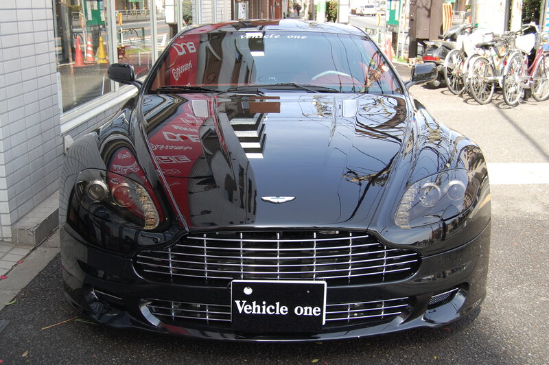 Black Aston Martin parked on street