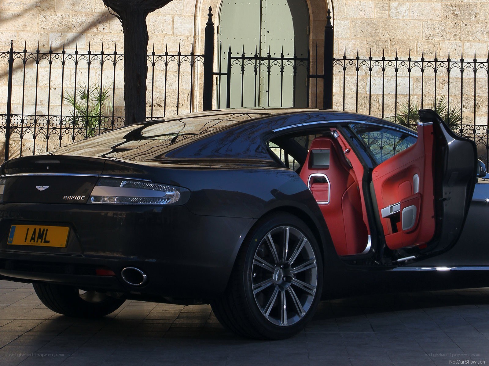 Black Aston Martin Rapide with open door