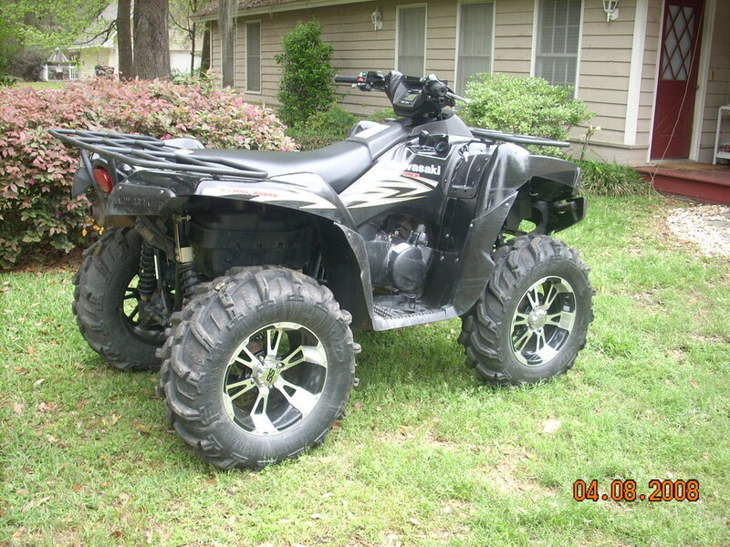 black atv on grass