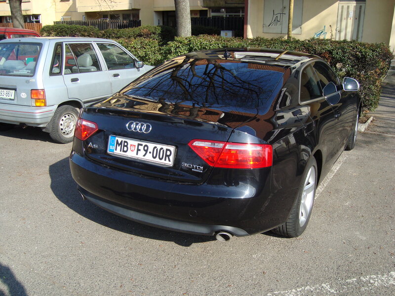 Black Audi A5 parked in lot