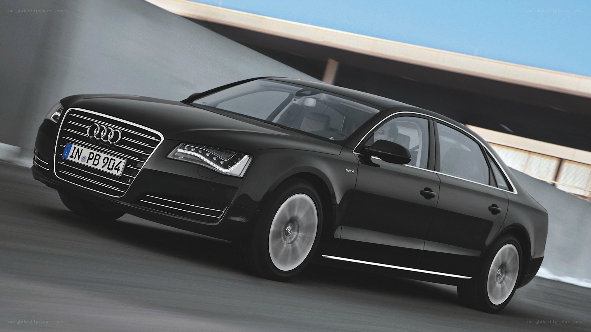 Black Audi A8 driving on road