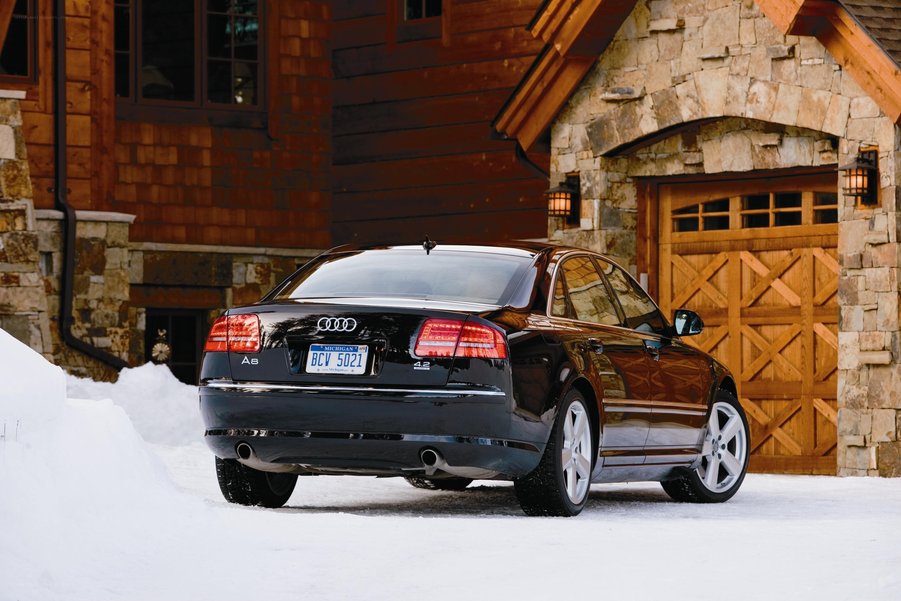 Black Audi A8 in snowy setting