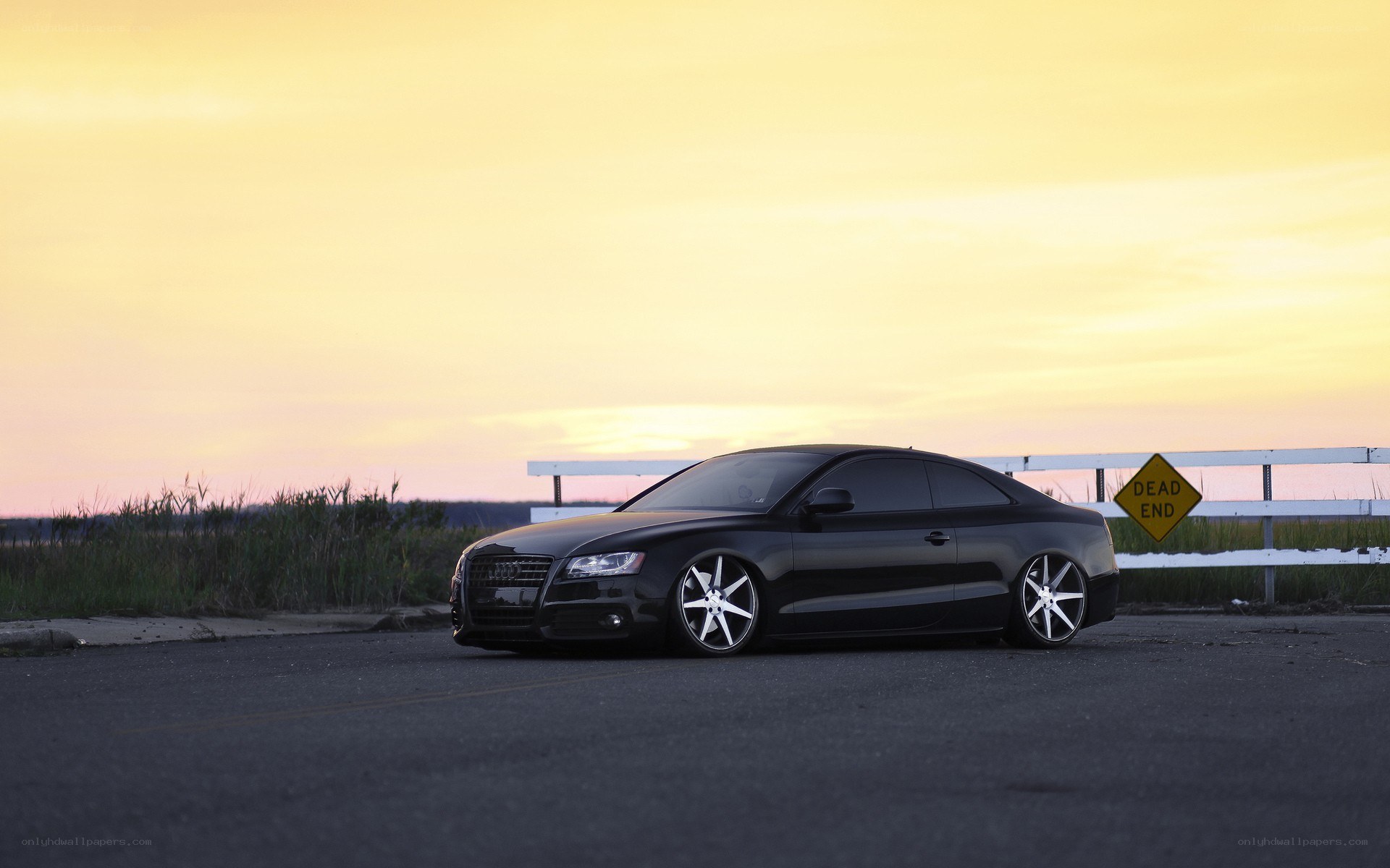 Black Audi at sunset