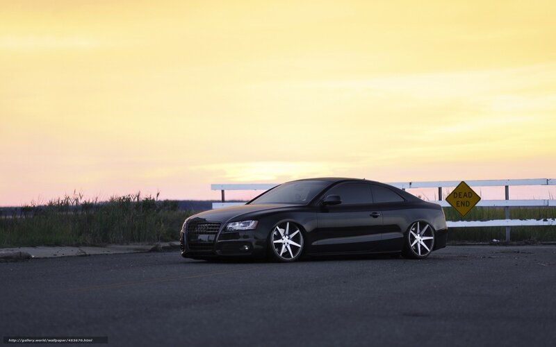 Black Audi at sunset
