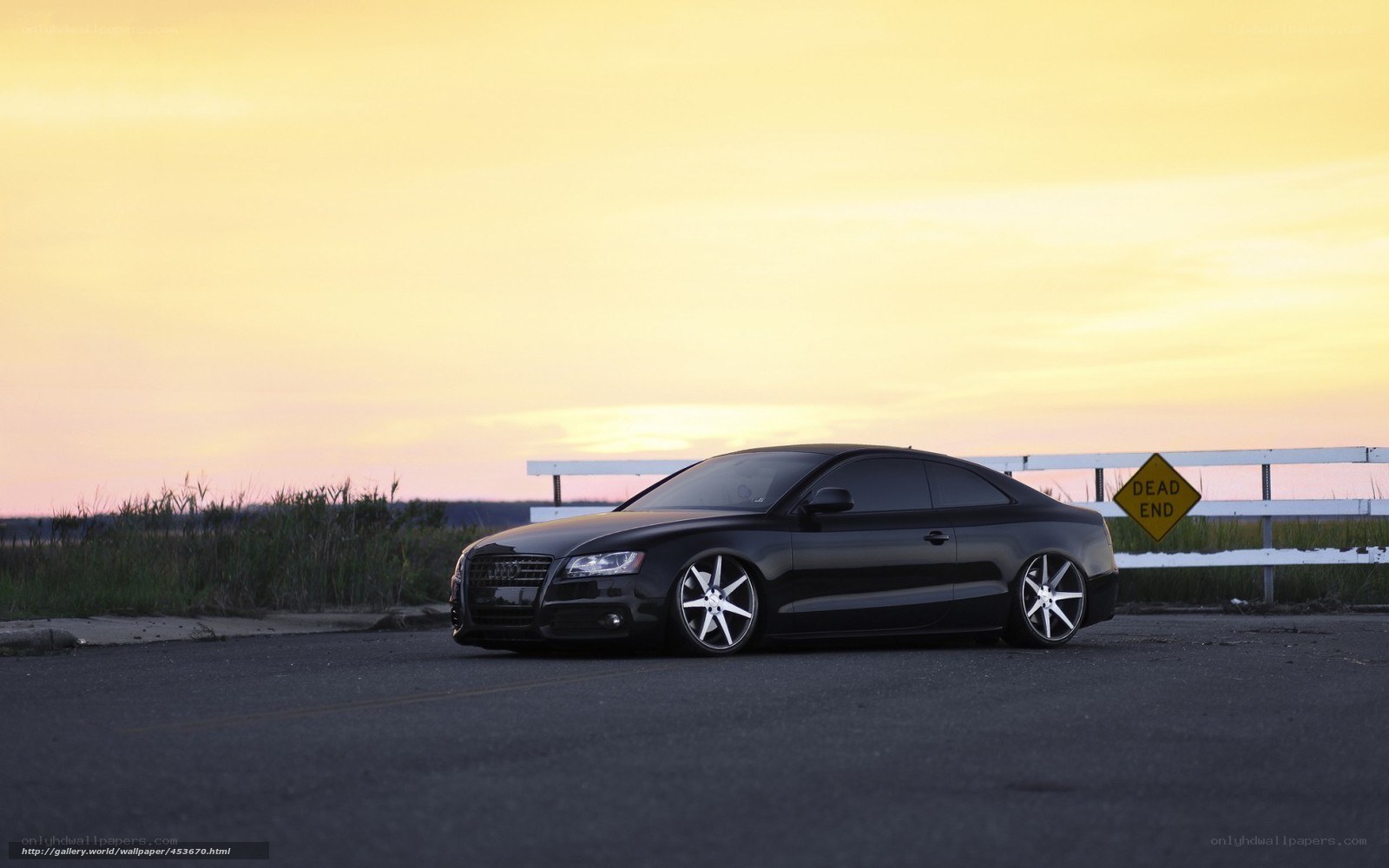 Black Audi at sunset