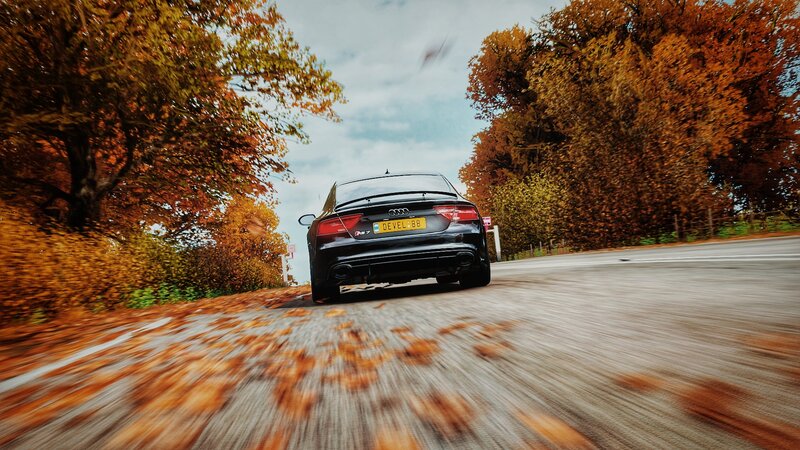 Black Audi Car on Road — Brown