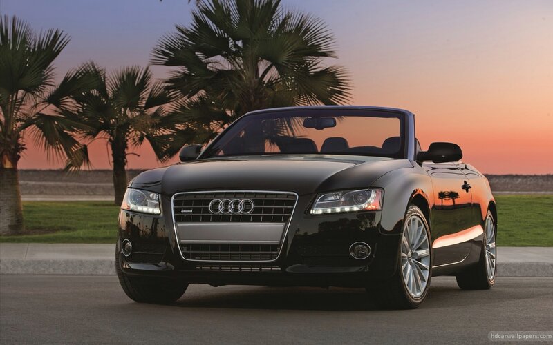 Black Audi convertible at sunset