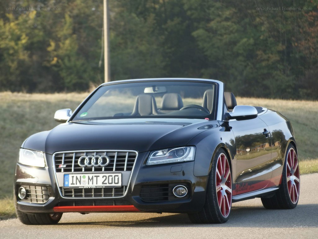 Black Audi convertible on road