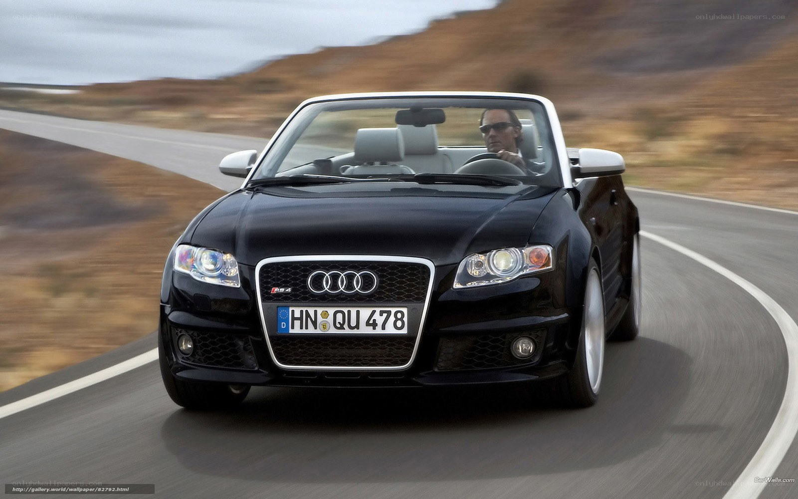 Black Audi convertible on road
