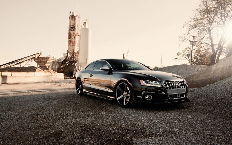 black audi coupe at industrial site